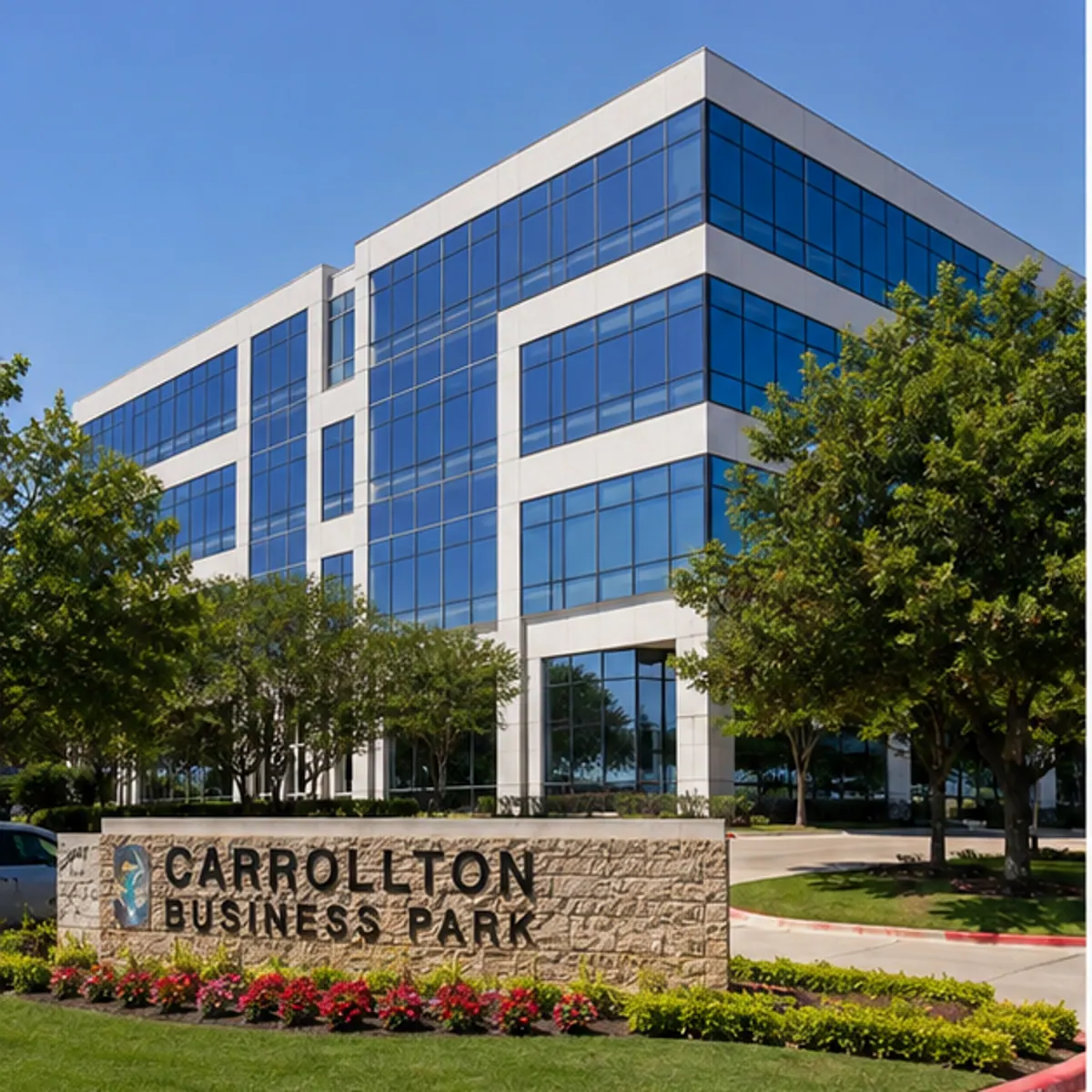 A multi-story glass office building at a Carrollton business park